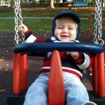 Happiness is swinging in a park Happiness is swinging in a park