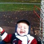 Happiness is swinging in a park on a sunny afternoon Happiness is swinging in a park on a sunny afternoon